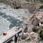 An aerial view of a bridge collapsed due to flash-floods