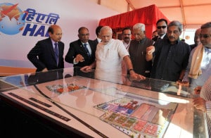The Prime Minister, Shri Narendra Modi at the foundation stone laying ceremony for HAL's Helicopter Factory, at Tumakuru, Karnataka on January 03, 2016. 	The Governor of Karnataka, Shri Vajubhai Rudabhai Vala, the Union Minister for Defence, Shri Manohar Parrikar, the Chief Minister of Karnataka, Shri Siddaramaiah and other dignitaries are also seen.