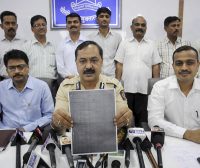 Thane Crime Branch officials show a examination paper of the Army Recruitment Board that was allegedly leaked