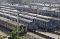 Parked passengers trains are seen at a railway station in Mumbai