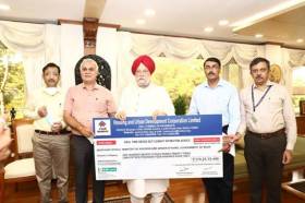 HUDCO hands over a cheque of Rs 174.23 Crore