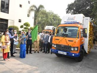 flags off Food Safety Awareness vehicles